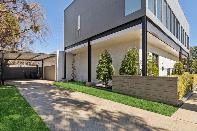 view of side of home featuring a carport