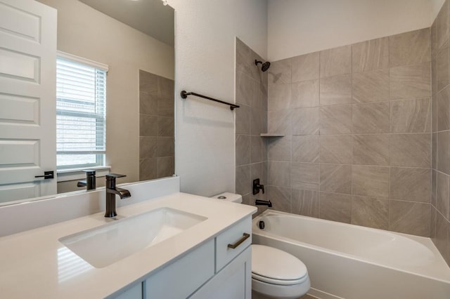 full bathroom with vanity, toilet, and washtub / shower combination