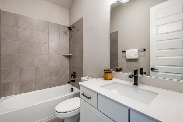 bathroom featuring toilet, bathtub / shower combination, and vanity