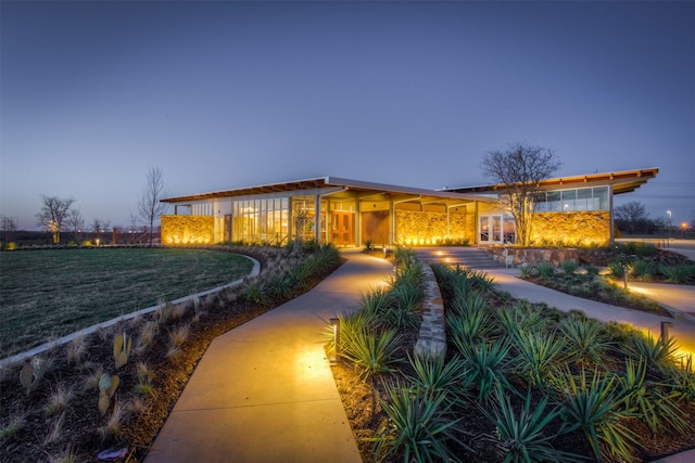 ranch-style house with a lawn