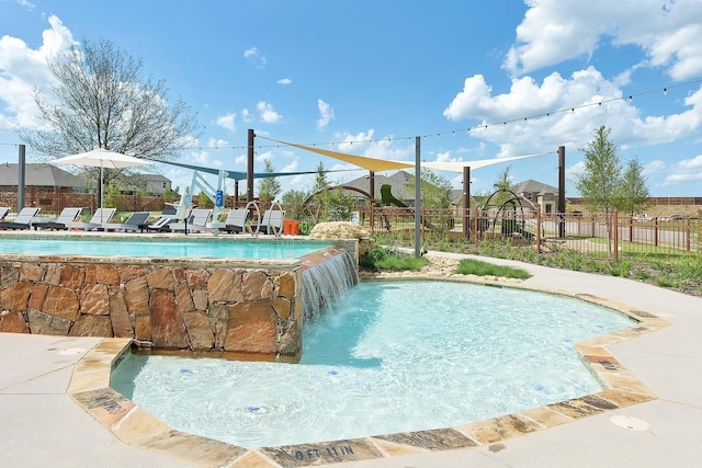 view of swimming pool featuring pool water feature