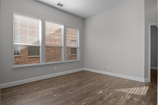 empty room featuring dark hardwood / wood-style floors