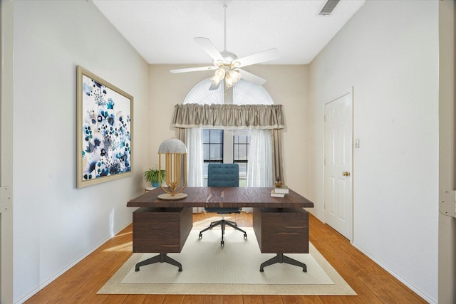 office with hardwood / wood-style floors and ceiling fan