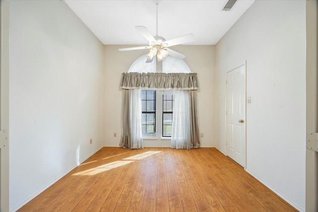 unfurnished room with light hardwood / wood-style floors and ceiling fan