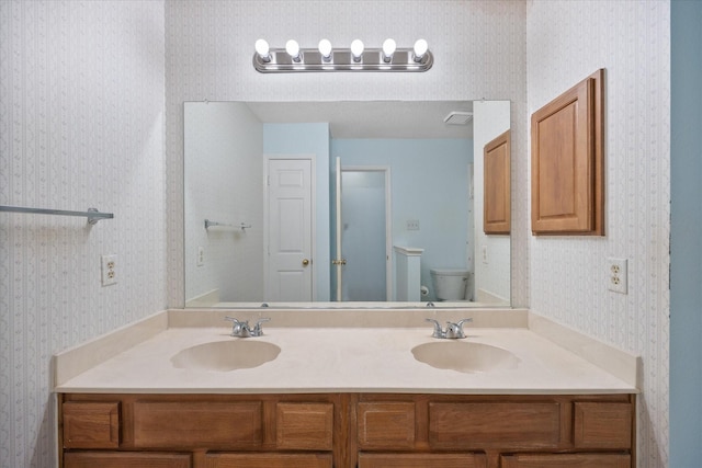 bathroom with vanity and toilet