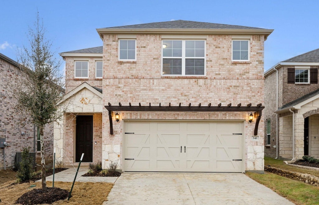 view of front of home featuring a garage