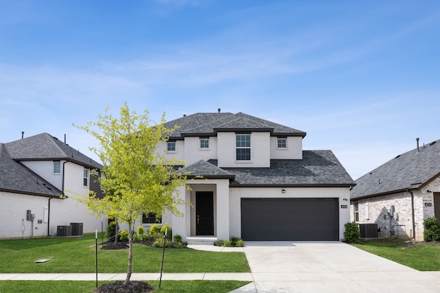 view of front of property with central AC unit and a front lawn