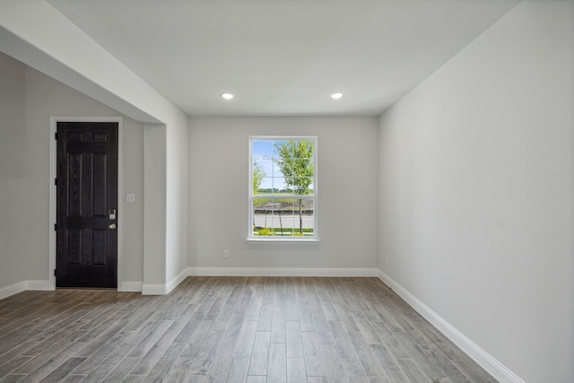 unfurnished room featuring light hardwood / wood-style flooring