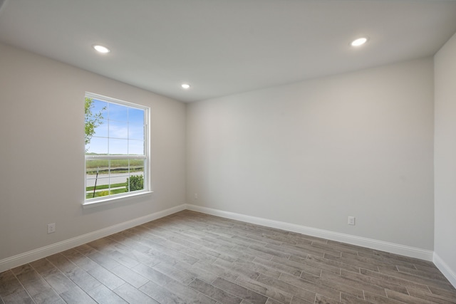 unfurnished room featuring light hardwood / wood-style flooring