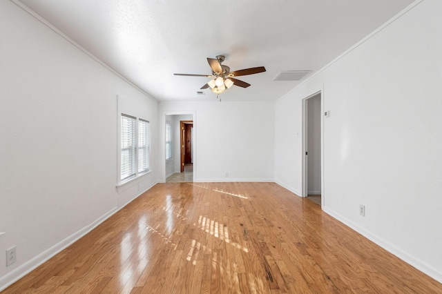 spare room with ceiling fan and light hardwood / wood-style floors