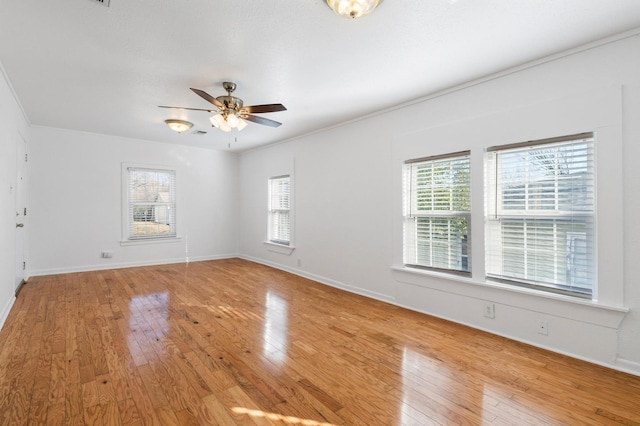 unfurnished room with ceiling fan, light hardwood / wood-style floors, and ornamental molding