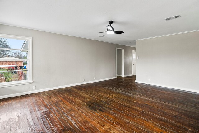 empty room featuring ceiling fan and dark wood-type flooring