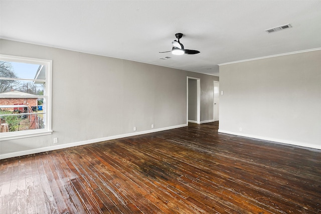 spare room featuring dark hardwood / wood-style floors and ceiling fan