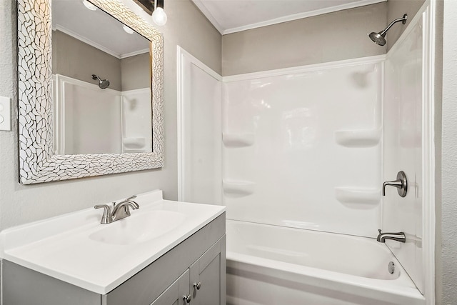 bathroom with vanity, crown molding, and bathing tub / shower combination