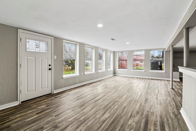 unfurnished living room featuring dark hardwood / wood-style flooring