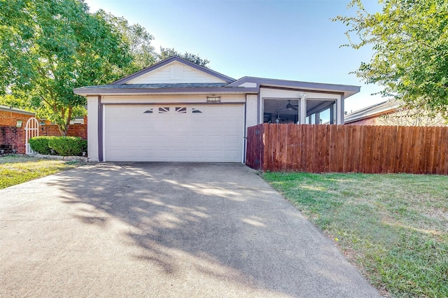 view of front facade with a front yard and a garage