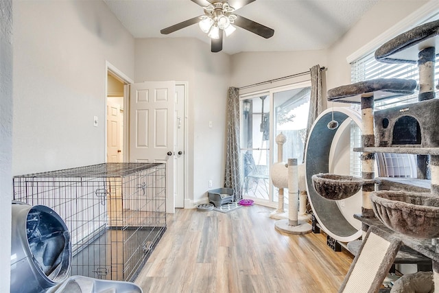 interior space with a textured ceiling, hardwood / wood-style flooring, and ceiling fan