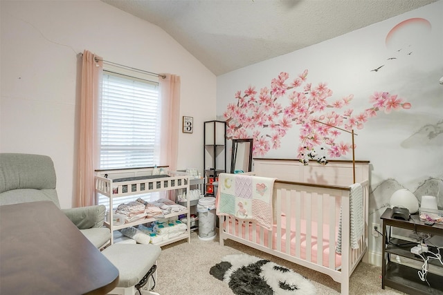 bedroom with carpet floors, a nursery area, and vaulted ceiling