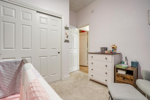 carpeted bedroom featuring a closet