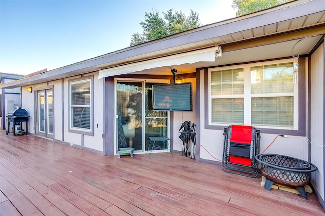 wooden deck with area for grilling