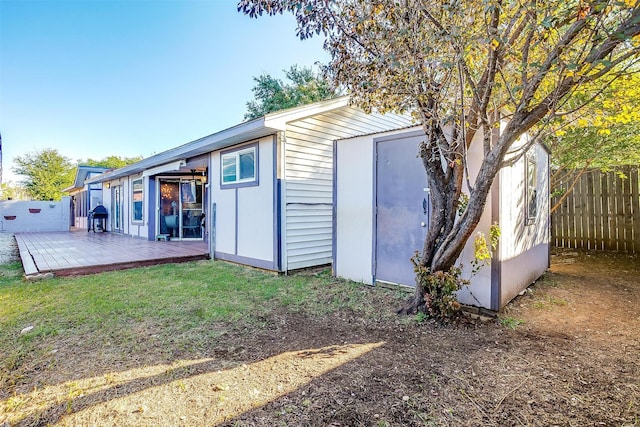 view of outbuilding with a lawn