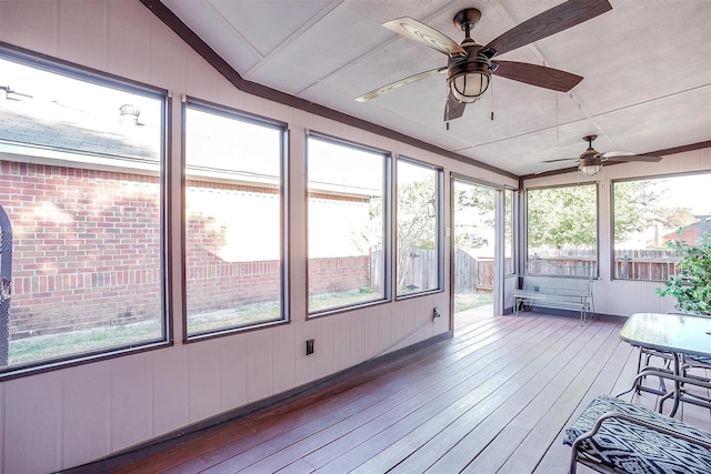 unfurnished sunroom with ceiling fan and lofted ceiling