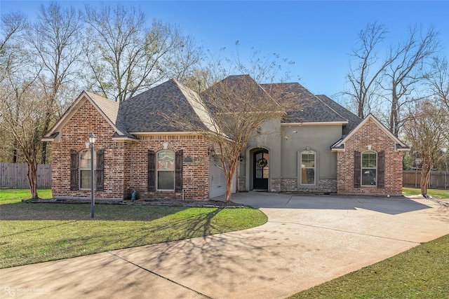 view of front of home featuring a garage and a front yard