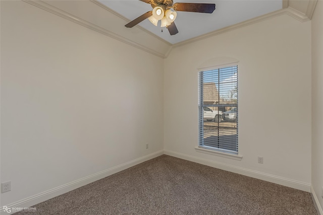 carpeted spare room with ceiling fan and ornamental molding