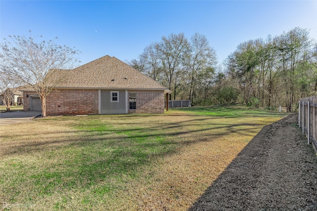 view of yard featuring a garage