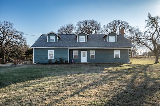 new england style home with a front lawn