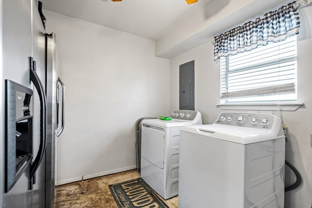 clothes washing area with electric panel and independent washer and dryer