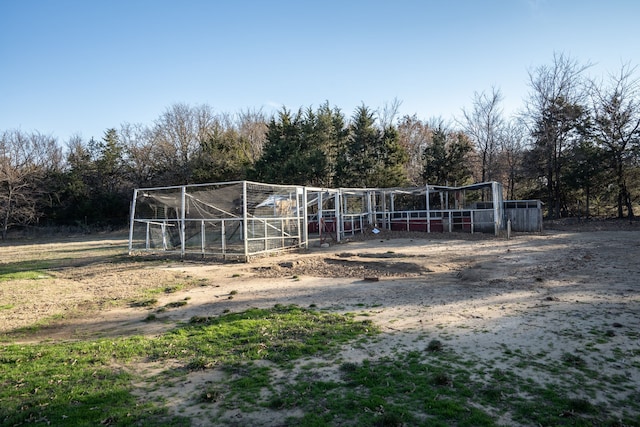 view of horse barn featuring a rural view