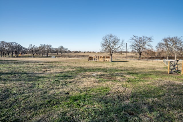 view of yard with a rural view