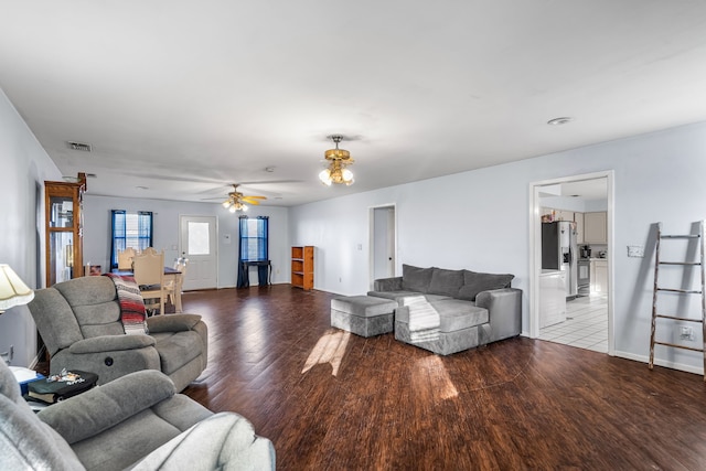 living room featuring hardwood / wood-style flooring and ceiling fan