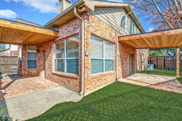 exterior space featuring a patio and a yard