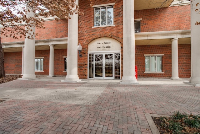 view of exterior entry featuring french doors