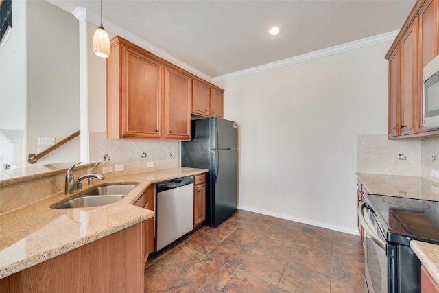 kitchen featuring pendant lighting, sink, ornamental molding, stainless steel appliances, and light stone countertops