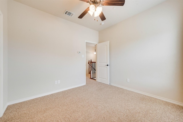 empty room with carpet floors and ceiling fan