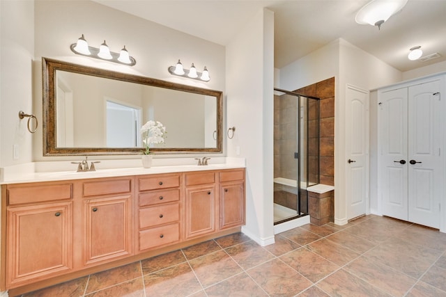 bathroom with walk in shower and vanity