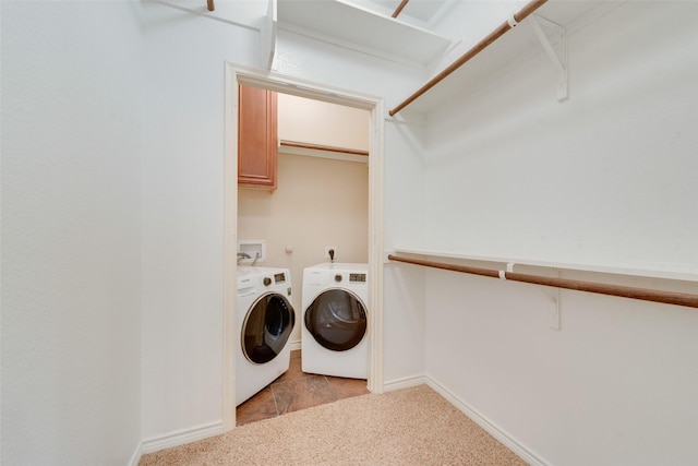 laundry area featuring washer and dryer and light colored carpet