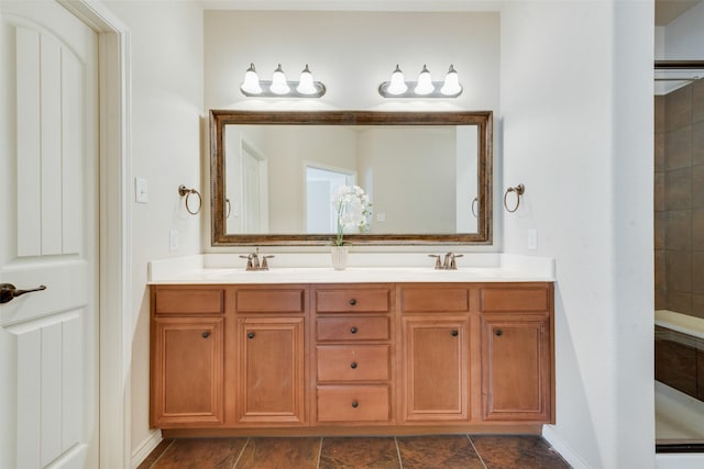 bathroom featuring an enclosed shower and vanity