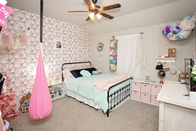 carpeted bedroom with vaulted ceiling and ceiling fan