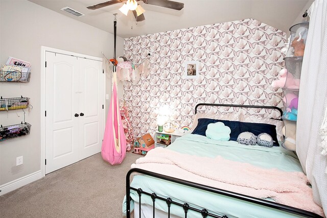 carpeted bedroom with a closet and ceiling fan