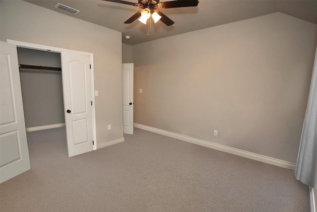 unfurnished bedroom featuring ceiling fan, a closet, and carpet