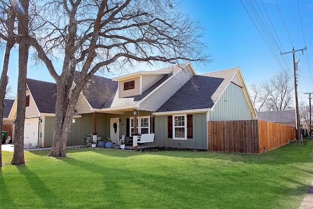 view of front facade with covered porch and a front yard