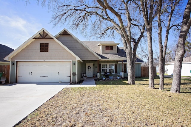 view of front of house featuring a front lawn and a garage