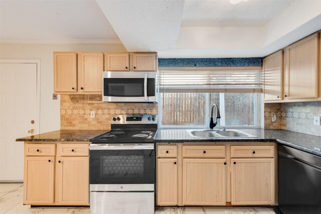 kitchen with decorative backsplash, light brown cabinetry, stainless steel appliances, sink, and dark stone countertops