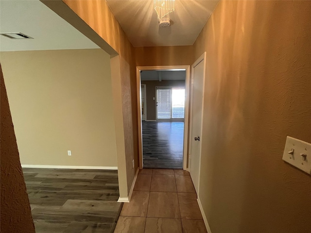 hallway with dark hardwood / wood-style floors