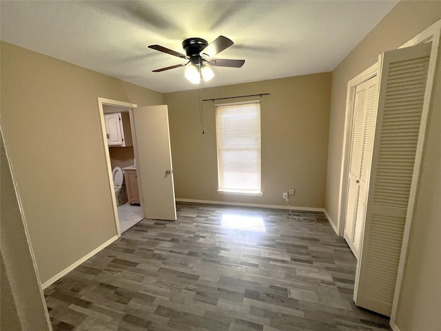 unfurnished bedroom with hardwood / wood-style flooring, ceiling fan, and a closet