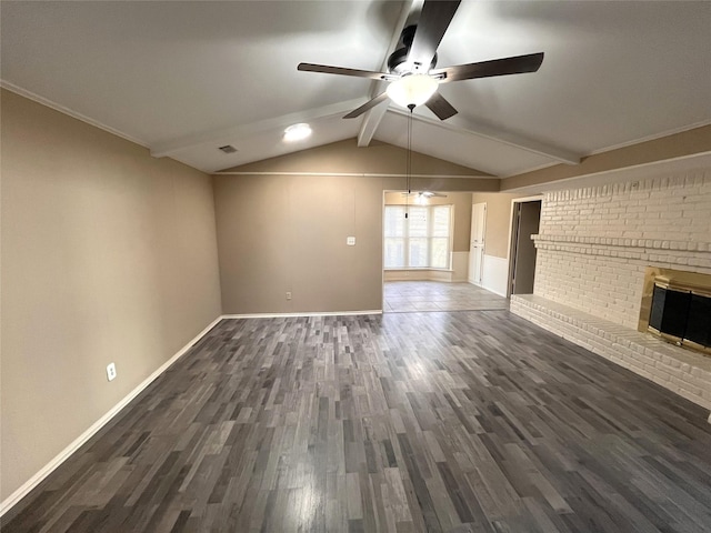 unfurnished living room with dark wood-type flooring, ceiling fan, a fireplace, and vaulted ceiling with beams